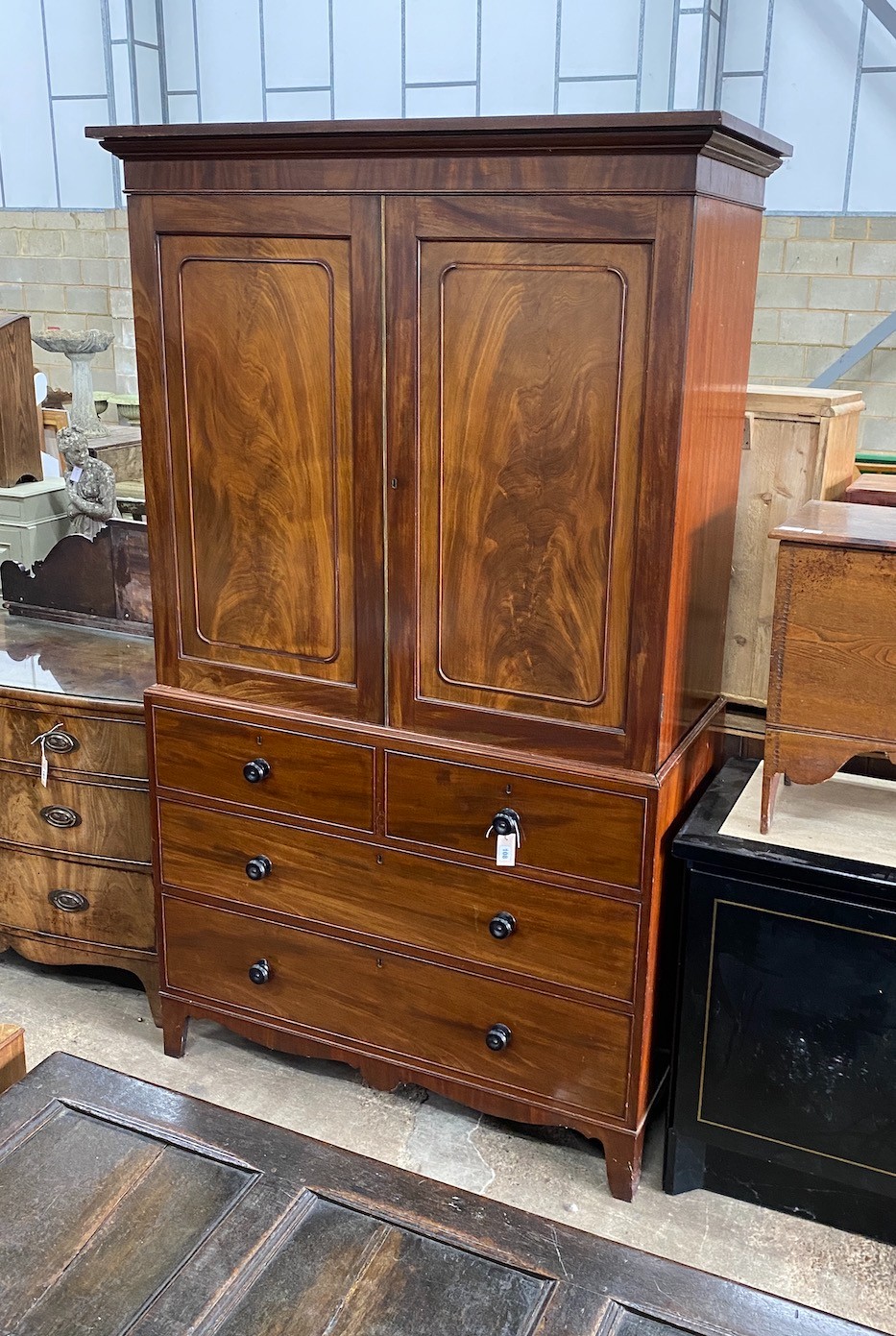 A Regency mahogany linen press, width 122cm, depth 56cm, height 214cm